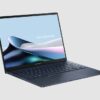 Asus Zenbook 14 OLED UX3405MA side view Asus Zenbook 14 OLED UX3405MA in Ponder Blue, three-quarter side view showing the keyboard and ports