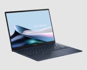 Asus Zenbook 14 OLED UX3405MA in Ponder Blue, three-quarter side view showing the keyboard and ports